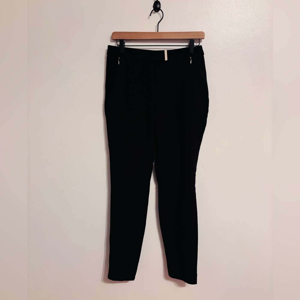 h&m black dress pants with gold detail at belt buckle zippered pockets size 6